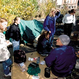 Over the fire this morning, Mark, Paul, Jeff, and Shirley are charring pastrami sandwiches that one of them had rescued from a dumpster. Robert Hubner