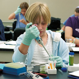 Katie Chamberlain, an 11-year-old sixth grader at Roosevelt Elementary in Spokane, tests 'Martian' fecal and digestive samples for starch and protein. In the background, Chelsea Momany and Grace Chapin also practice their analytical skills. Jeff T. Green Katie Chamberlain, an 11-year-old sixth grader at Roosevelt Elementary in Spokane, tests 'Martian' fecal and digestive samples for starch and protein. In the background, Chelsea Momany and Grace Chapin also practice their analytical skills. Jeff T. Green