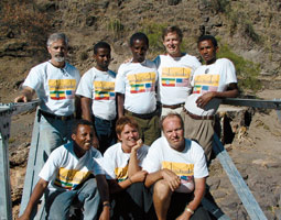 Top, l. to r.: Randy Stacey, volunteer; Hussein, nurse at free clinic; Burre, camp security chief; Ken Frantz, project leader; Amar, camp aide. Bottom, l. to r.: Dr. Mengistu Mekonnen of the free clinic; Zoe Keone, logistics and photography; and Gary Bunch, volunteer. By Melaku Zeleke