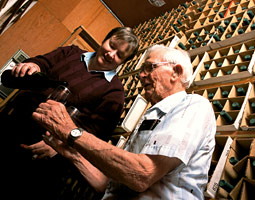 Wine researcher Sara Spayd pours a glass of experimental wine for Walt Clore in WSU's IAREC wine library at Prosser. Robert Hubner Wine researcher Sara Spayd pours a glass of experimental wine for Walt Clore in WSU's IAREC wine library at Prosser. Robert Hubner