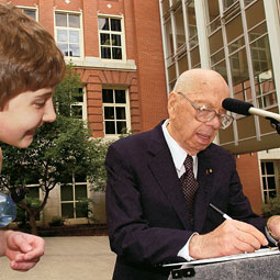 Philip Abelson, shown here at the dedication of Abelson Hall, has led a dynamic scientific life, having made contributions in such diverse fields as biochemistry, chemistry, engineering, and physics. Robert Hubner