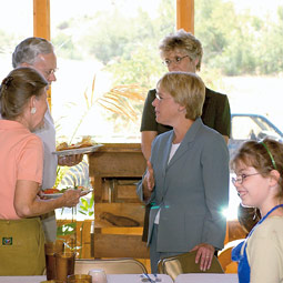 Murray visits with Pataha citizens following lunch served by the children in the historic Pataha Flour Mill, just east of Pomeroy, Washington. Shelly Hanks