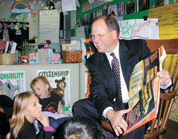 Superintendent of Spokane Area Schools Brian Benzel '70 obviously enjoys reading to schoolchildren. Terren Roloff