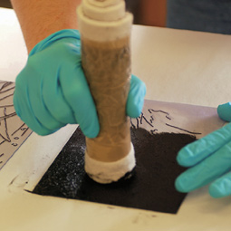 Inking the engraving.
