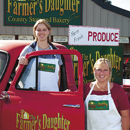 With Marci Schwartz '03 and Trish Scwartz '00 (not shown), Tessa Wicks '96, M.S. '98 (left) and proprietor Kim Roberts '81, '82 (right) run the newly opened Farmer's Daughter, which markets regionally grown food, including flour made from a hard red winter wheat developed by spring wheat breeder Kim Kidwell. With Marci Schwartz '03 and Trish Scwartz '00 (not shown), Tessa Wicks '96, M.S. '98 (left) and proprietor Kim Roberts '81, '82 (right) run the newly opened Farmer's Daughter, which markets regionally grown food, including flour made from a hard red winter wheat developed by spring wheat breeder Kim Kidwell.