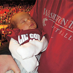Cougar-in-training: Isaac Hammond visits Friel Court in the arms of his father Travis '01.
