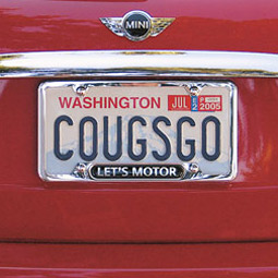 Cougs on the move: Wayne and Barb Bradford '58 of La Conner make their statement of school spirit in a crimson 'Cougar Cooper.'