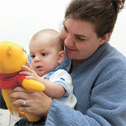 Bringing up baby. Eight-month-old Brandon Hallan and his mother Shyra play with a toy for a WSU study of temperament in infants.