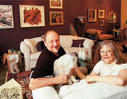 Jim Kolva '68 and Pat Sullivan amidst a part of their collection, which includes many pieces by WSU alumni and faculty.