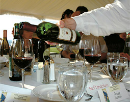 A server pours a Cave B merlot that was among the entries. Winemakers rely on awards from this judging and other to know if their wines are meeting popular tastes and to draw consumer attention.