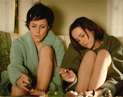 Mary, played by Jena Malone (right), and her mother, Mary-Louise Parker, share a moment in <em>Saved!</em>.