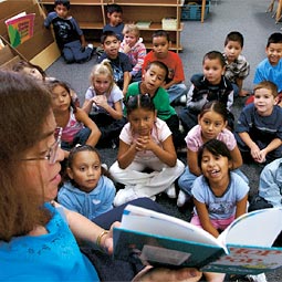 Katherine Myers '73 reads to her first-graders in an activity designed to expose them to rhyming.