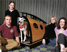 Left to right: Students Josh Schafer '06, Kelly Gordon '07, Whitney Wiggins '06, and Kendra Lundahl '06 designed the winning doghouse for Basil the whippet in a 30-hour design challenge at the WSU Interdisciplinary Design Institute in Spokane. Left to right: Students Josh Schafer '06, Kelly Gordon '07, Whitney Wiggins '06, and Kendra Lundahl '06 designed the winning doghouse for Basil the whippet in a 30-hour design challenge at the WSU Interdisciplinary Design Institute in Spokane.