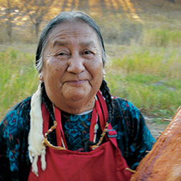 Geraldine Jim roasts salmon for the Plateau Conference at WSU.