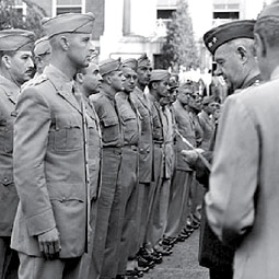 Arden Dow receiving a medal from William Donovan.