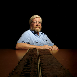 To find out what plants were growing near a study site, John G. Jones takes samples from one- to two-inch intervals along a yards-deep soil core. A series of acid baths will dissolve extraneous material and transform each sample into a clean specimen of pollen grains and residual charcoal.