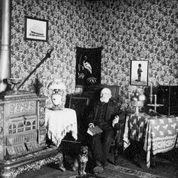 Cashup sits in the elaborate splendor of his parlor. The crowds ceased coming in spite of all the available luxuries and novelties he had acquired for his resort. <em>Photo courtesy of WSU - MASC.</em>