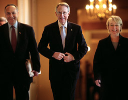 Patty Murray and Senator Charles Schumer (D-NY) escort the newly elected Senate Majority Leader Harry Reid (D-Nev.) in November 2006. <em>Melina Mara/The Washington Post.</em>