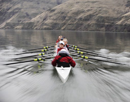 Women's crew team rowing on the Snake River.