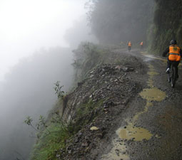The World's Most Dangerous Road, in Bolivia, offers spectacular views and landscapes as well as spectacular
weather. Here a group rides down through a rain storm. Photo courtesy Derren Patterson.