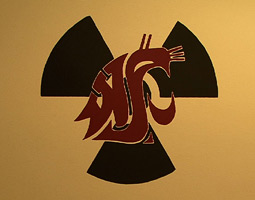 A Cougar-themed sign graces the door to the reactor. <em>Video still by Matthew Haugen</em>
