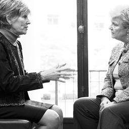 State Senator Linda Evans Parlette ’68 (left) a Chelan Republican, confers about health care reform with Seattle-area Democratic Senator Karen Keiser (right). By Robert Hubner