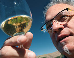 Alan Busacca has taken his fascination with terroir to its logical and delicious conclusion, joining winemaker Robert Smasne ’99 to produce wines from Syrah grapes with identical techniques from three different vineyards. <em>Zach Mazur</em>