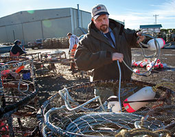 Brian Toste prepares a crab trap for the winter Dungeness season. <em>Bill Wagner</em>