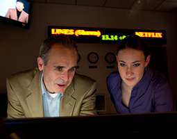 WSU finance professor Rick Sias and finance student Stacee Wilson in the Cougar Investment Fund trading room in Todd Hall. Photo by Robert Hubner WSU finance professor Rick Sias and finance student Stacee Wilson in the Cougar Investment Fund trading room in Todd Hall. Photo by Robert Hubner