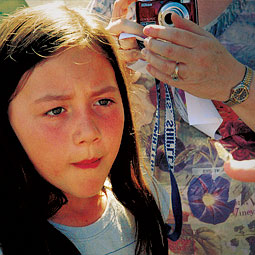 A budding naturalist examines a Becker’s White on James’s finger. <em>Staff photo</em>