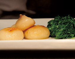 A small plate awaits a finishing touch at Spring Hill. <em>Zach Mazur</em>