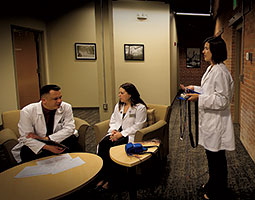 A four-bedroom apartment is home away from home for sleep subjects studied by (left to right) Hans Van Dongen and staffers Devon Grant, Amy Bender, and Mike Winser in the Human Sleep and Cognition Laboratory. Photo Robert Hubner