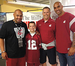 Derek Sparks ’95 (left) and Mkristo Bruce ’06 (right) pose with Coug fans on a September weekend when dozens of football players came back to campus. <em>Courtesy Derek Sparks</em> Derek Sparks ’95 (left) and Mkristo Bruce ’06 (right) pose with Coug fans on a September weekend when dozens of football players came back to campus. <em>Courtesy Derek Sparks</em>