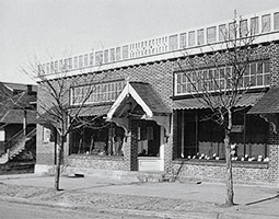 A new wood-framed building with exterior brick was constructed in 1923 next to the music conservatory and financed by the Associated Students. Photo from 1924, courtesy WSU Manuscripts, Archives, and Special Collections. A new wood-framed building with exterior brick was constructed in 1923 next to the music conservatory and financed by the Associated Students. Photo from 1924, courtesy WSU Manuscripts, Archives, and Special Collections.