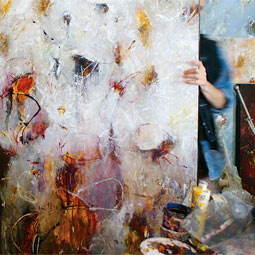In his Ballard studio, Schultheis arranges canvases ready for a gallery show in New York City.