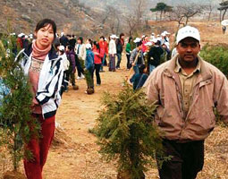 Students helped to plant millions of trees and shrubs in and around Beijing as the city prepared to host the Olympic Games. Courtesy Beijing Organizing Committee.