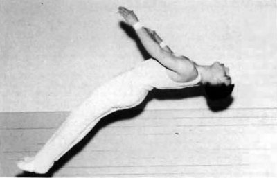Dick Van Hersett, western champion in tumbling and seventh in the nation last year, is shown here tumbling.