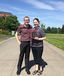 Nikki Hinshaw stands with Nolan Yaws who nominated her for her outstanding contributions to WSU Vancouver.